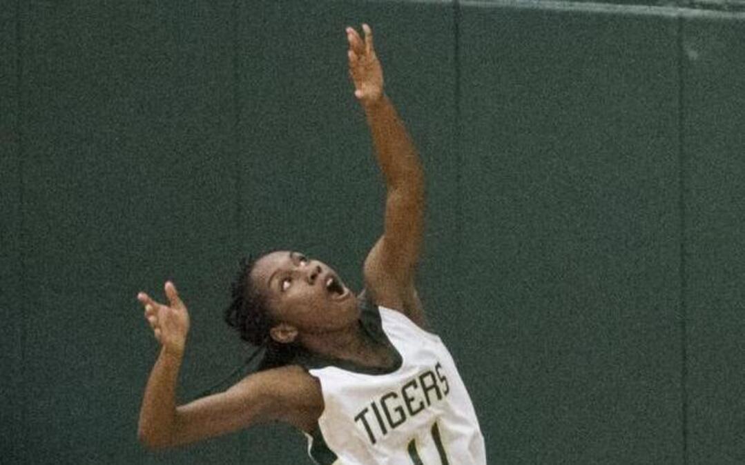 Conway’s Lenaejha Evans watches her shot fall through the hoop against Socastee.
