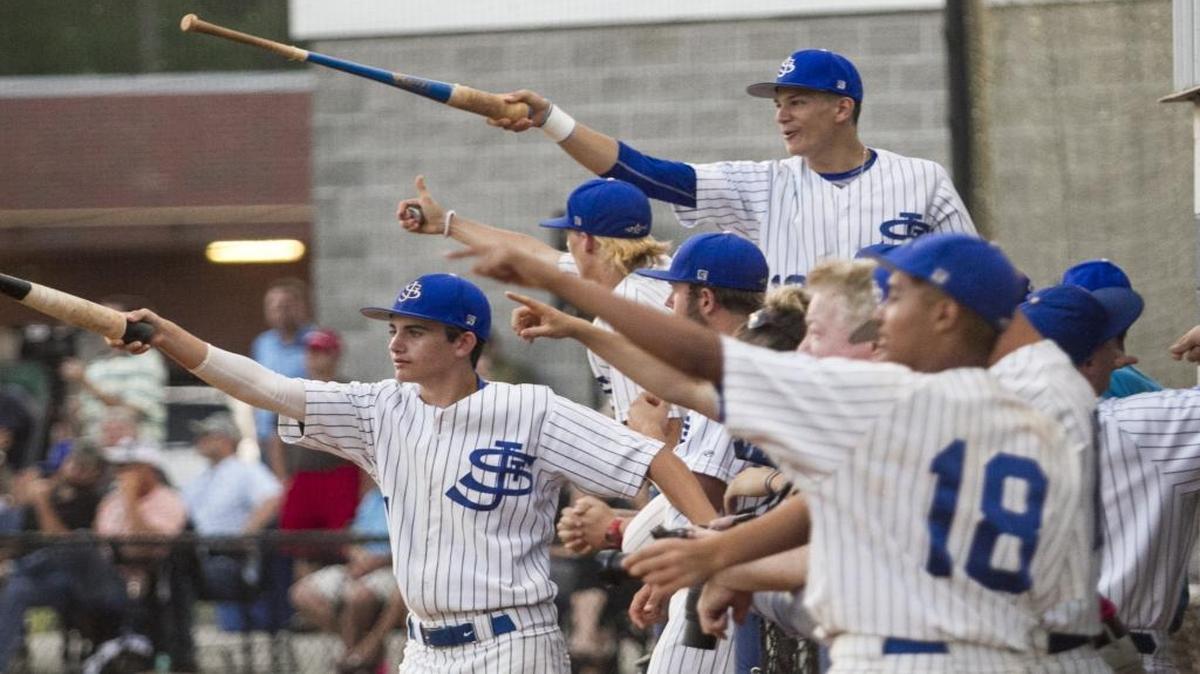 St. James baseball players celebrate a stellar defensive play during a game last season.