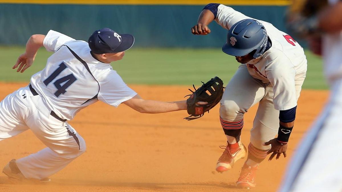 Aynor’s Hayden Franklin (left) makes the tag on Strom Thurmond’s Rod Dobbs during Game 1 of the Class AA state championship series.