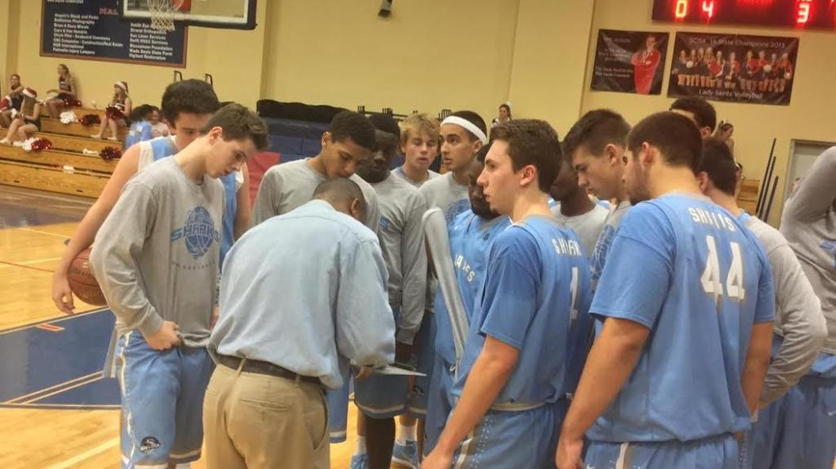 St. James coach Monty Carr instructs his team during halftime of the Sharks’ come-from-behind victory over Christian Academy of Myrtle Beach on Tuesday night.