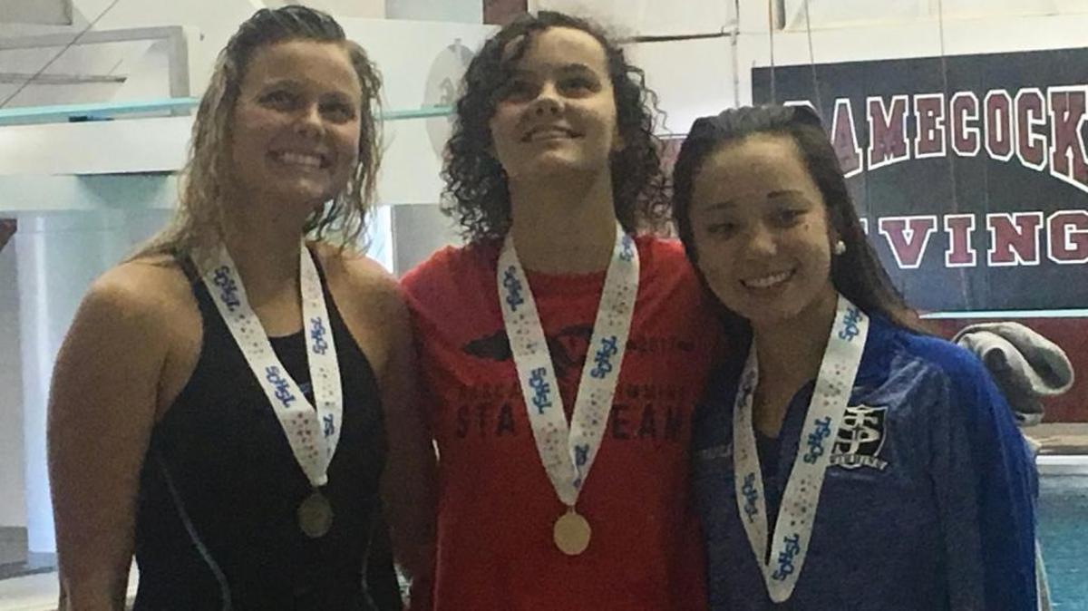 Waccamaw swimming standout Emma Sullivan is all smiles after claiming one of her two state titles on Saturday.