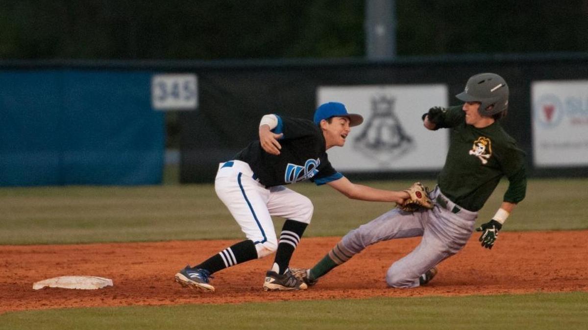 Myrtle Beach’s Jay Morris slides into second knocking the ball loose from St. James’ Andrew Leo as he goes for the tag. Both the Seahawks and Sharks begin their respective playoff journeys this week.
