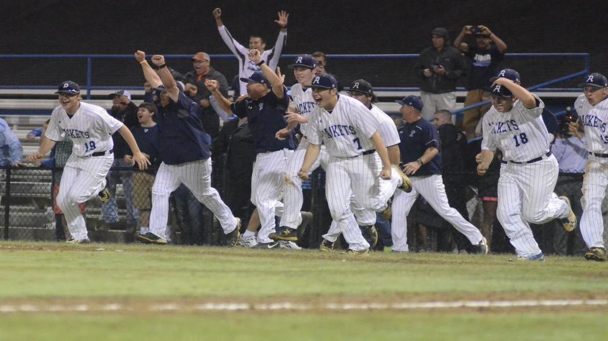 Aynor baseball players rush from the dugout after claiming the Class AA title over Strom Thurmond in May.