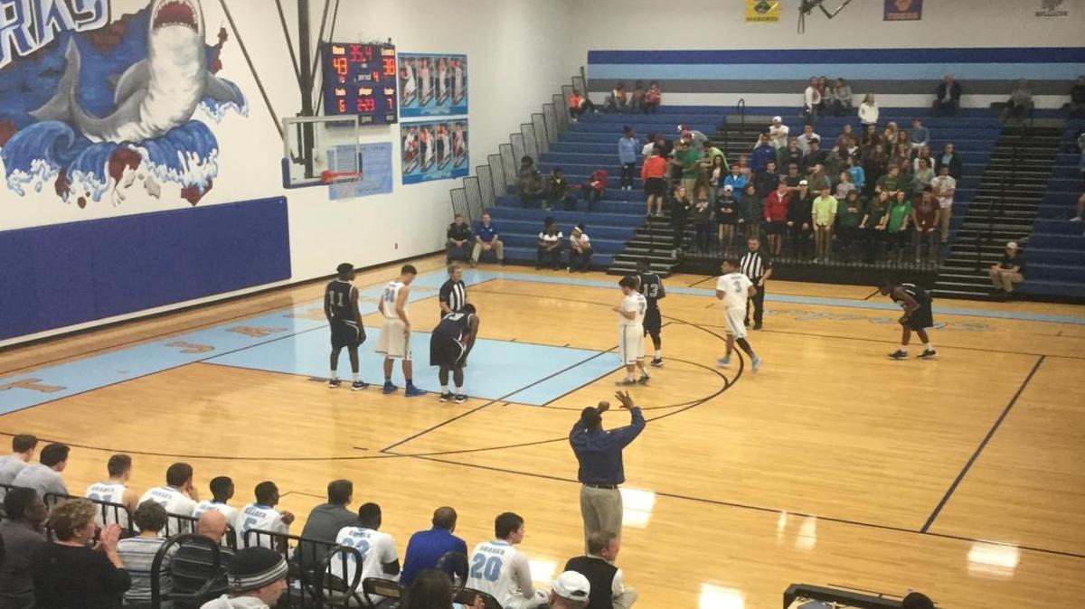 St. James coach Monty Carr (bottom) calls out instructions to his team during Friday’s game against Georgetown.