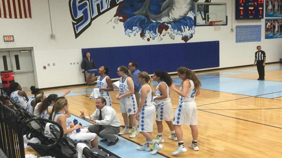 St. James coach Stan Patterson talks to his players during a timeout Friday.