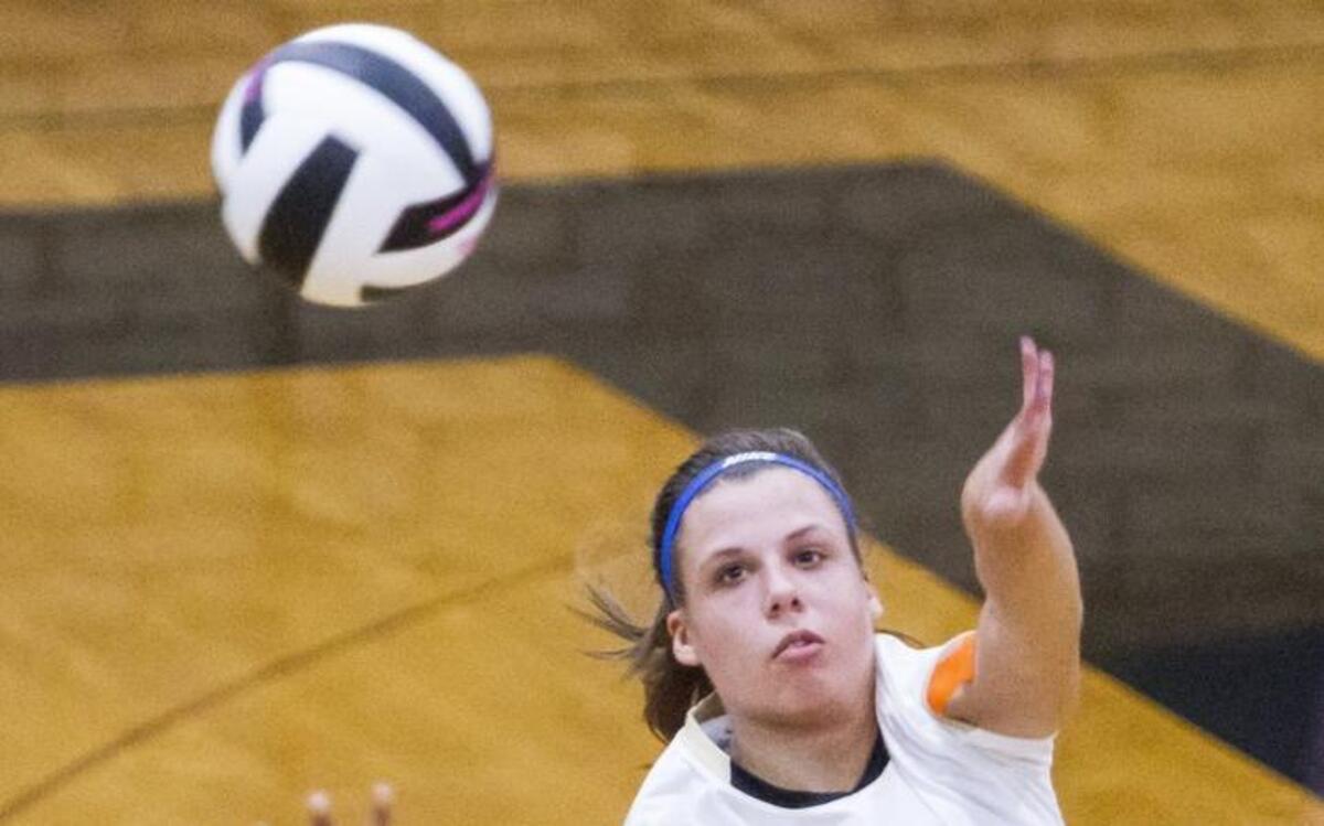 Socastee’s Dale Rogers spikes the ball past Spring Valley players during their first-round match.