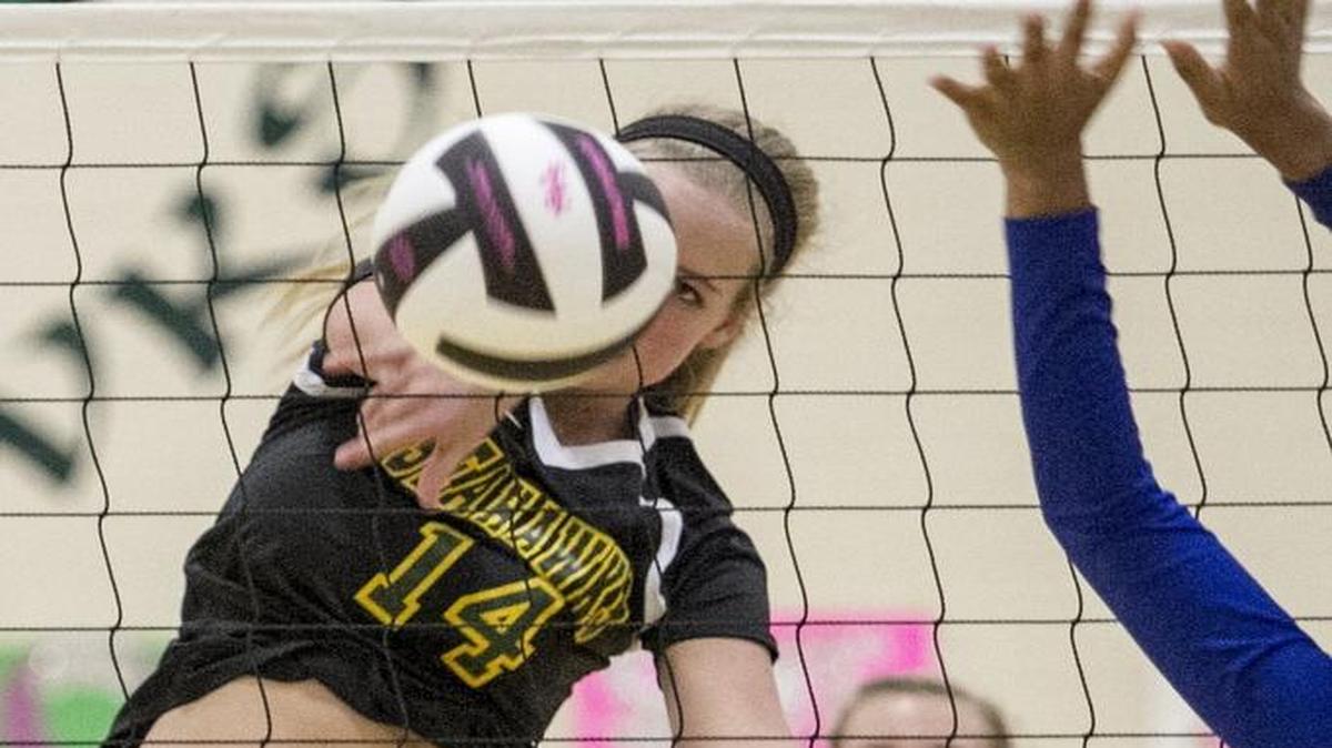 Myrtle Beach's Gracie Davis spikes the ball past Dreher defenders. Myrtle Beach girls volleyball dominated Dreher in the first round of the playoff Thursday night, 3-0. Oct. 27, 2016.