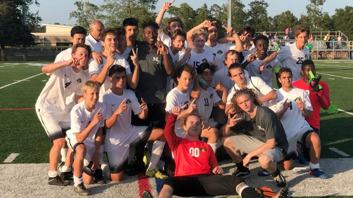 Myrtle Beach boys soccer players celebrate after claiming a 2-1 victory over rival North Myrtle Beach. In addition to bragging rights, the Seahawks claimed the Region VII-4A title.