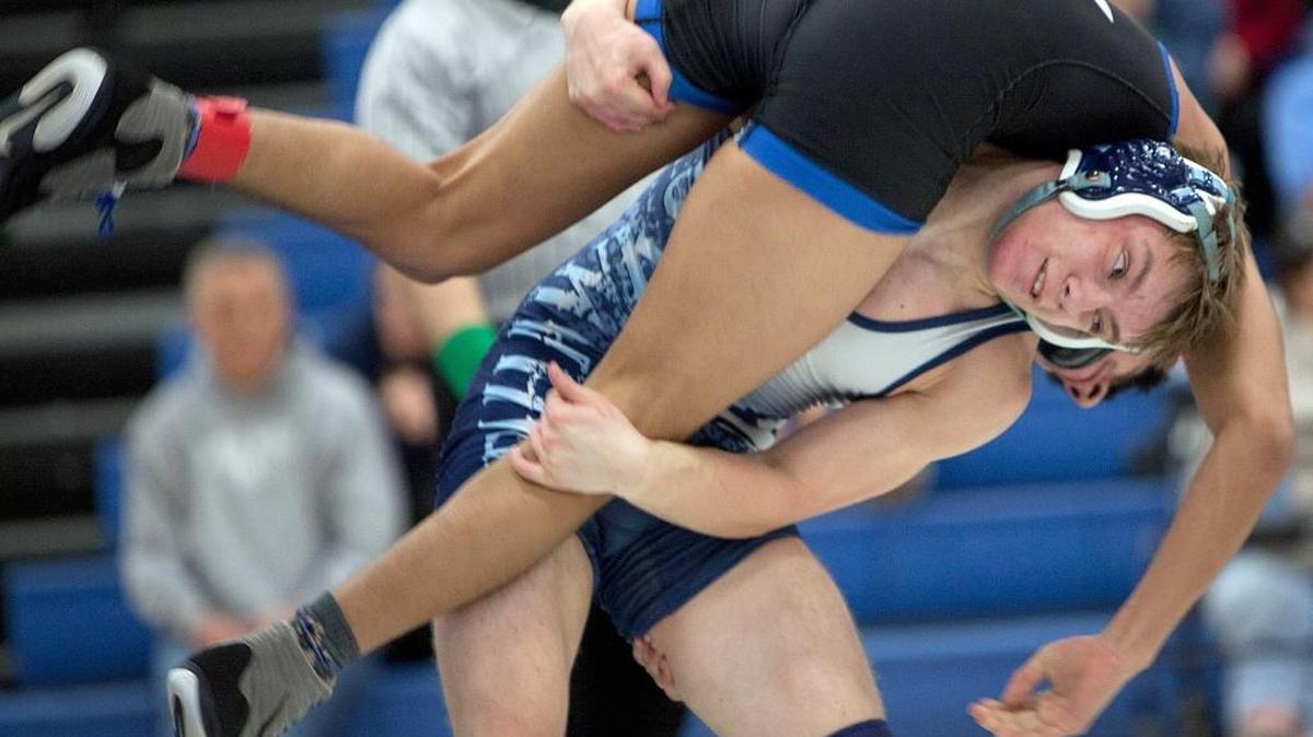 Hilton Head’s James Roberts (bottom) takes down St. James’ Uriel Mauricio in the 132-pound weight class matchup.