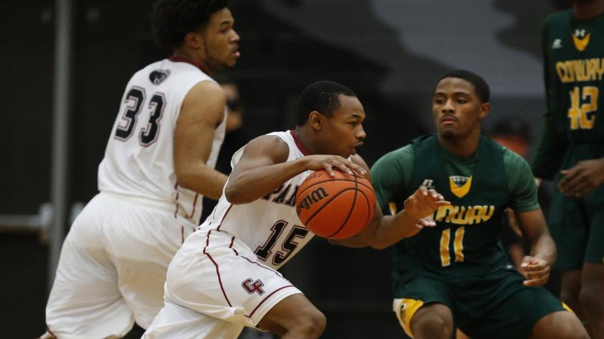 Wednesday night hoops matchups — like this one between rivals Conway and Carolina Forest — have become more common this season, the result of a change in scheduling by Region VI-5A athletic directors.