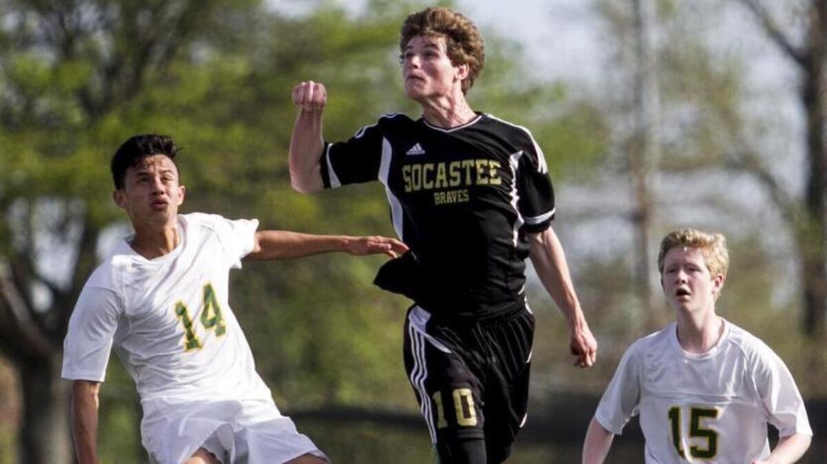 Jake Perito heads the ball against Myrtle Beach in the finals of Home Grown Hospitality Soccer at the Beach tournament. Perito scored both of Socastee’s goals leading to a 2-1 win on Thursday morning.