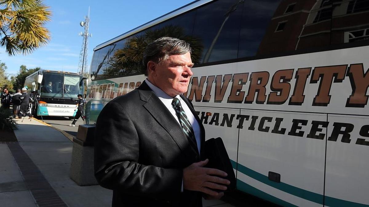 Coastal Carolina University football coach Joe Moglia boards a bus with his players for a trip to Christ Community Church in Conway to vote on Tuesday, Nov. 8, 2016.