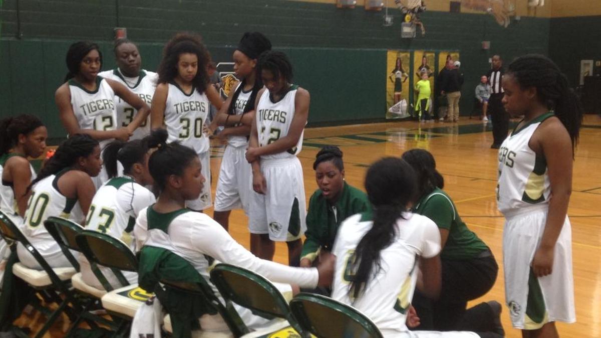 Conway coach Shamae Hemingway talks to her team during Friday’s game against Carolina Forest.