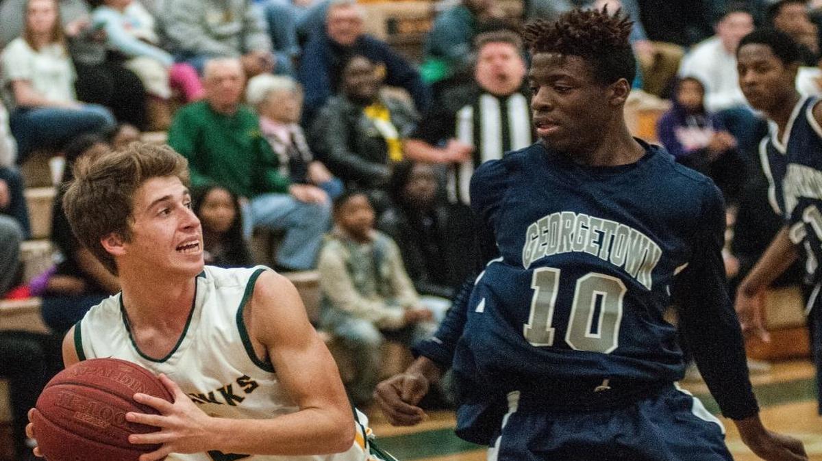 Myrtle Beach’s Robert Swanson (left) looks to pass against Georgetown’s Cavonte Gamble.