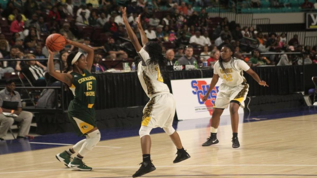 Conway’s Zakera Chadmon tries to beat the Goose Creek press during Saturday’s Lower State final in Florence.