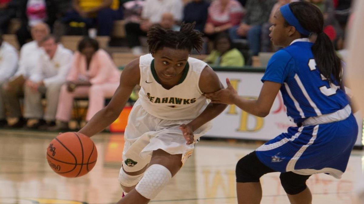 Myrtle Beach’s Ajia Kelly drives past a Dreher defender Tuesday.