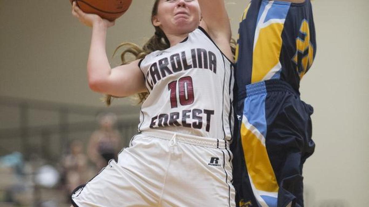 Carolina Forest sophomore Ellen Nardella (left) puts up a shot against South Florence on Friday.