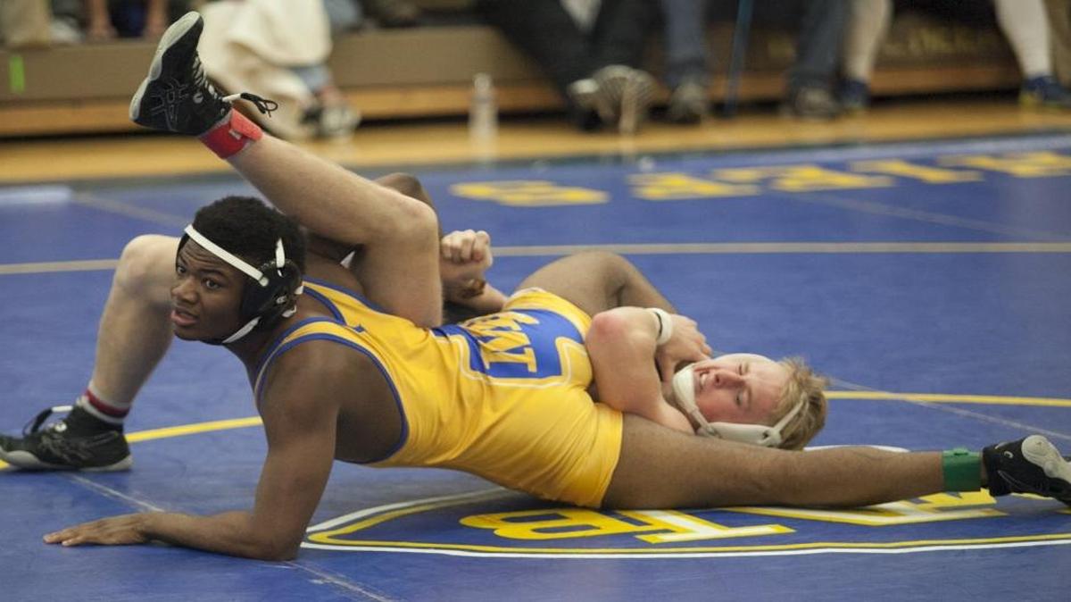 North Myrtle Beach’s Curtis Wolfe wrestles St. James' Will Stewart during a match this past season.