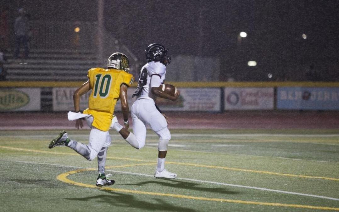 
During a driving rain, Carolina Forest running back Dyverse Simmons (28) runs in for a score against Myrtle Beach on Friday.
