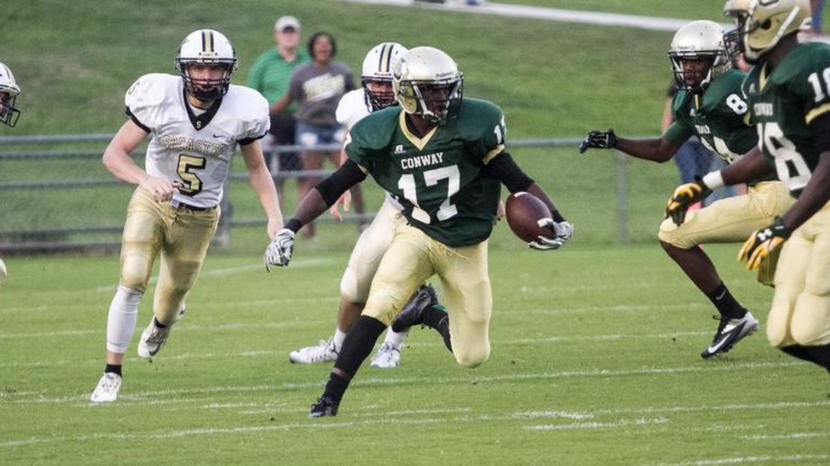 
Conway’s Juwon Moody runs back the opening kickoff for a touchdown against Socastee. 
