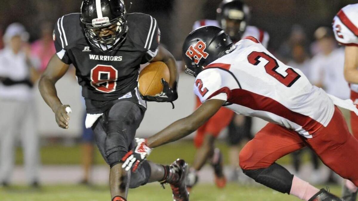 
Waccamaw’s Rashynne Knowlin (left) tries to dodge Hannah-Pamplico linebacker Malik Charles during Friday’s game.
