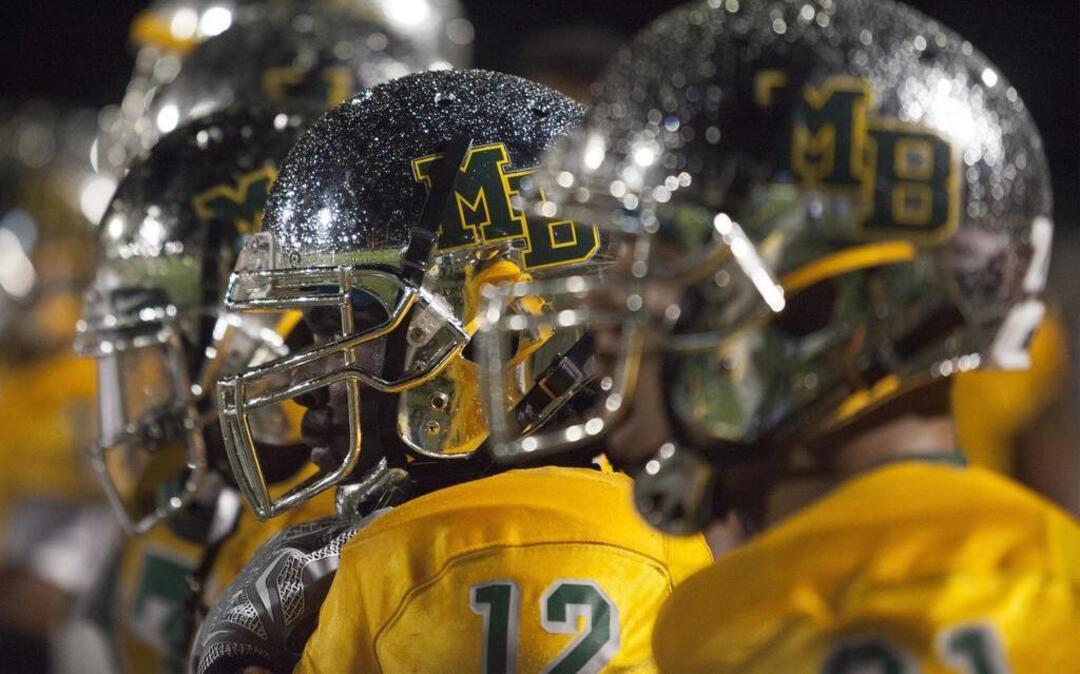 
During a rain storm, Myrtle Beach players look on from the sidelines during Friday night’s game against Carolina Forest.
