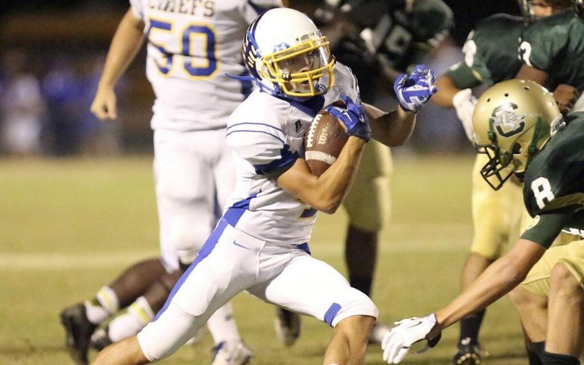 
North Myrtle Beach’s Kered Class (with ball) changes directions against Conway during the CNB Kickoff Classic.
