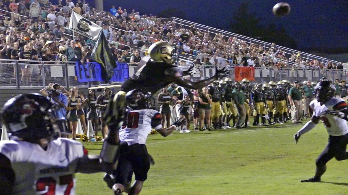 
Conway’s Bryan Edwards (top) attempts to make a catch against Hartsville earlier this season.
