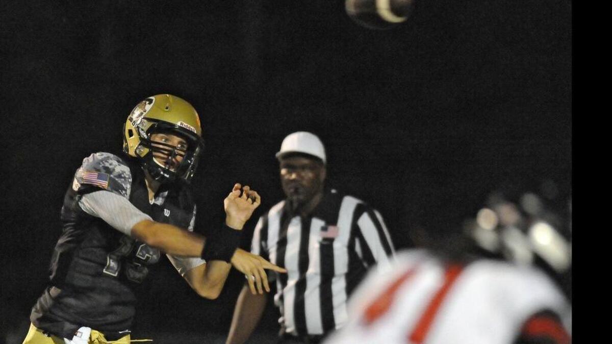 
Conway quarterback Peyton Derrick fires a pass during the first half against Hartsville on Friday.
