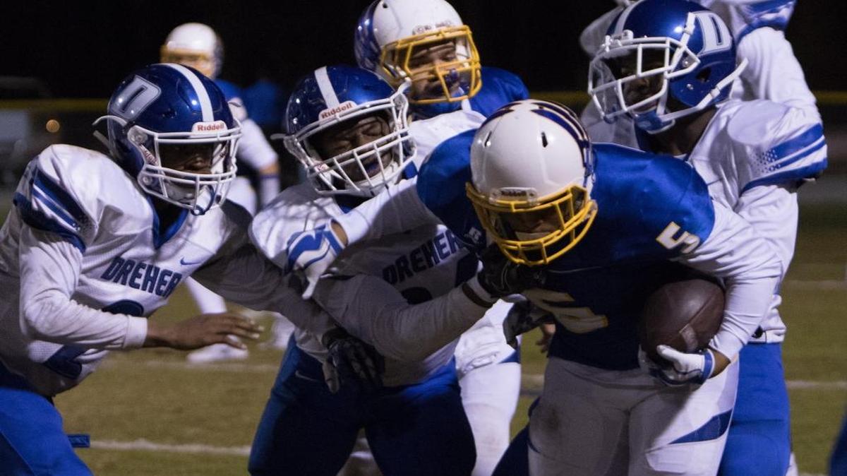 A host of Dreher tacklers try to bring down North Myrtle Beach running back T.J. Gore in last Friday’s first round playoff game.
