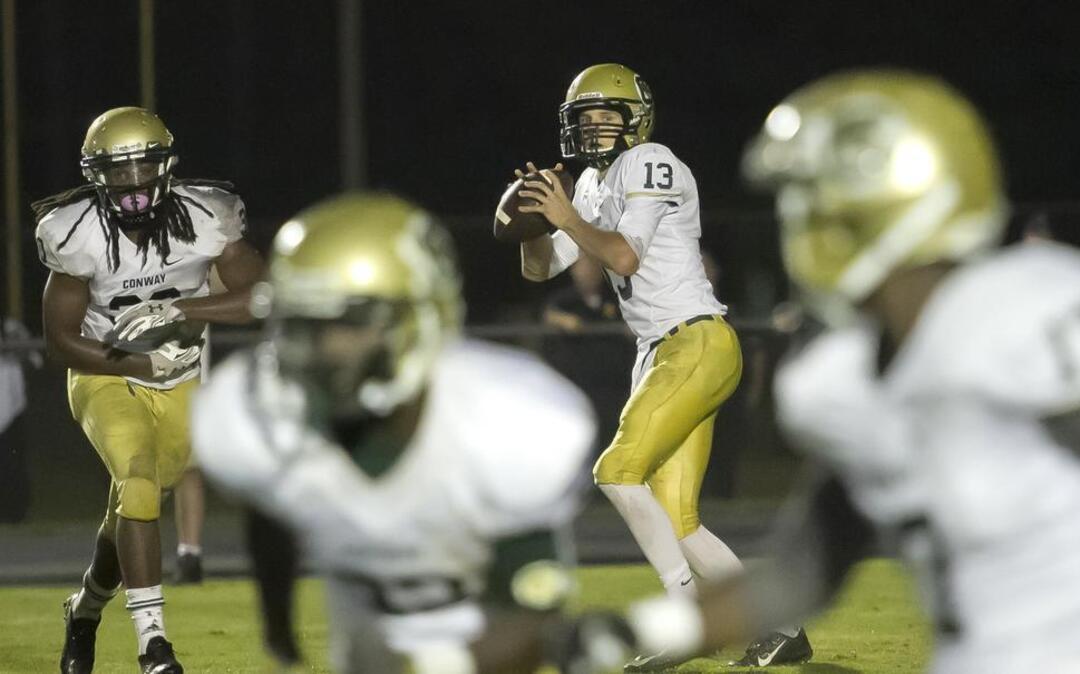 
Conway quarterback Peyton Derrick looks to throw during the second half of Friday’s game against Georgetown.

