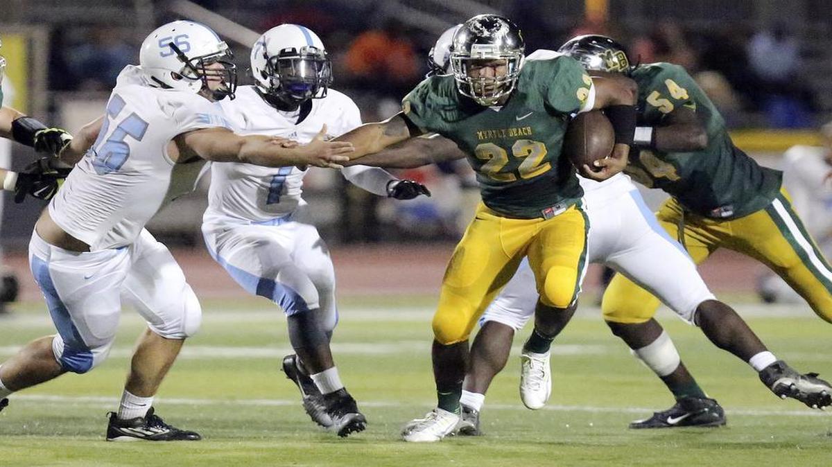 Myrtle Beach’s Brandon Sinclair looks for running room against St. James last Friday.