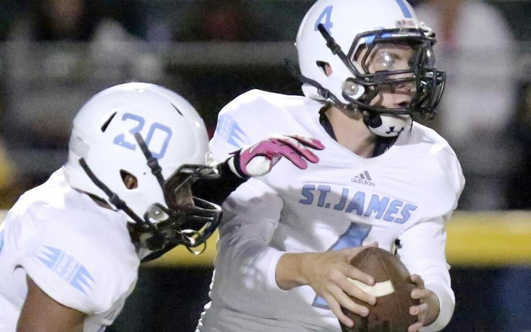 St. James’ Zach Werba (right) threw three touchdown passes against Midland Valley Friday night.
