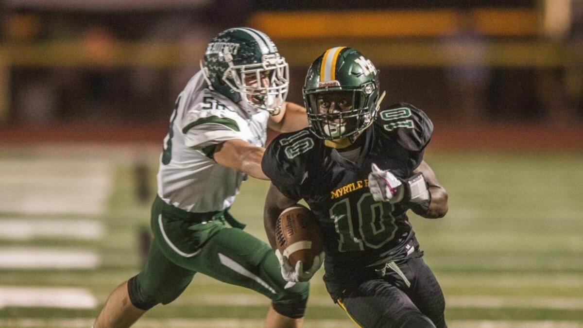 Jermani Green brings the ball down for Myetle Beach during the Beaufort at Myrtle Beach first-round playoff game.