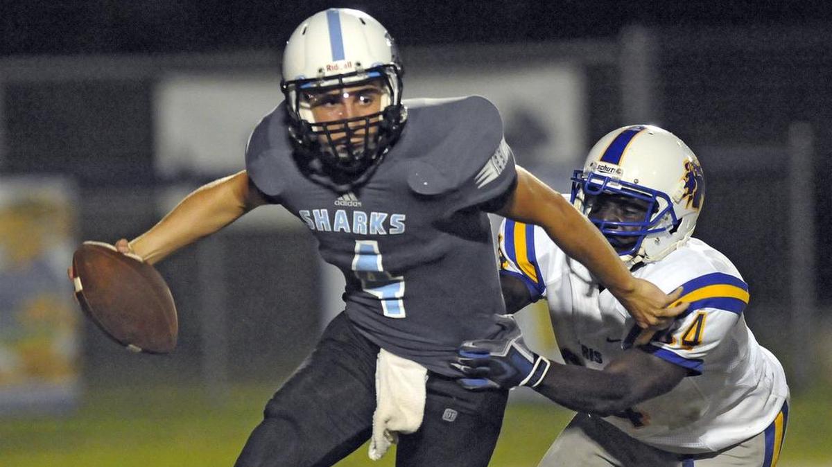 
Loris' Quiozel Wheeler (right) tackles St. James' Zach Werba.
