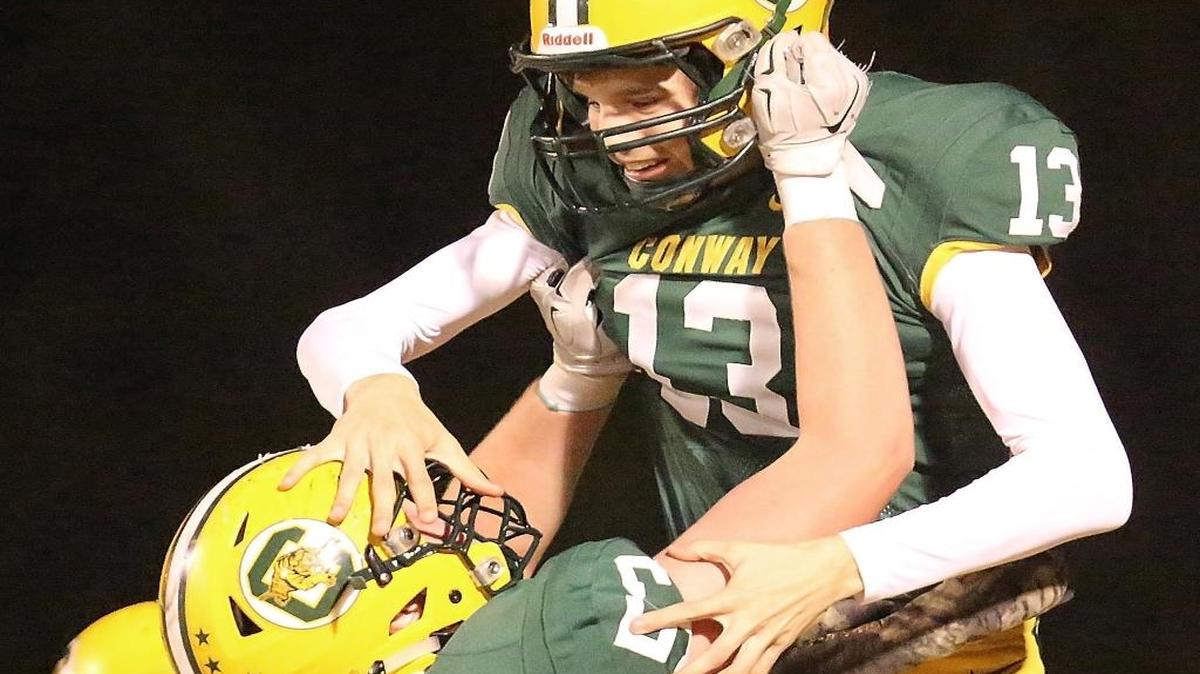 Conway’s Peyton Derrick (13) celebrates a touchdown against Goose Creek.