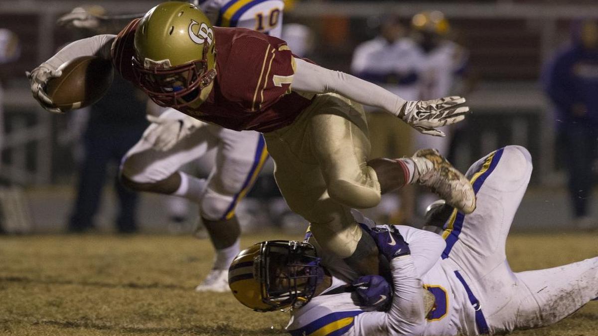 Carvers Bay running back Tyrek Reed (1) tries to gain extra yardage against Whale Branch last Friday night.
