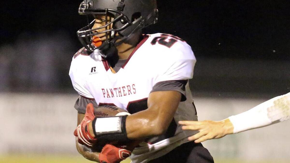 
 Carolina Forest's Dyverse Simmons (28) takes a handoff in the 26th annual CNB Kickoff Classic at Conway High School.

