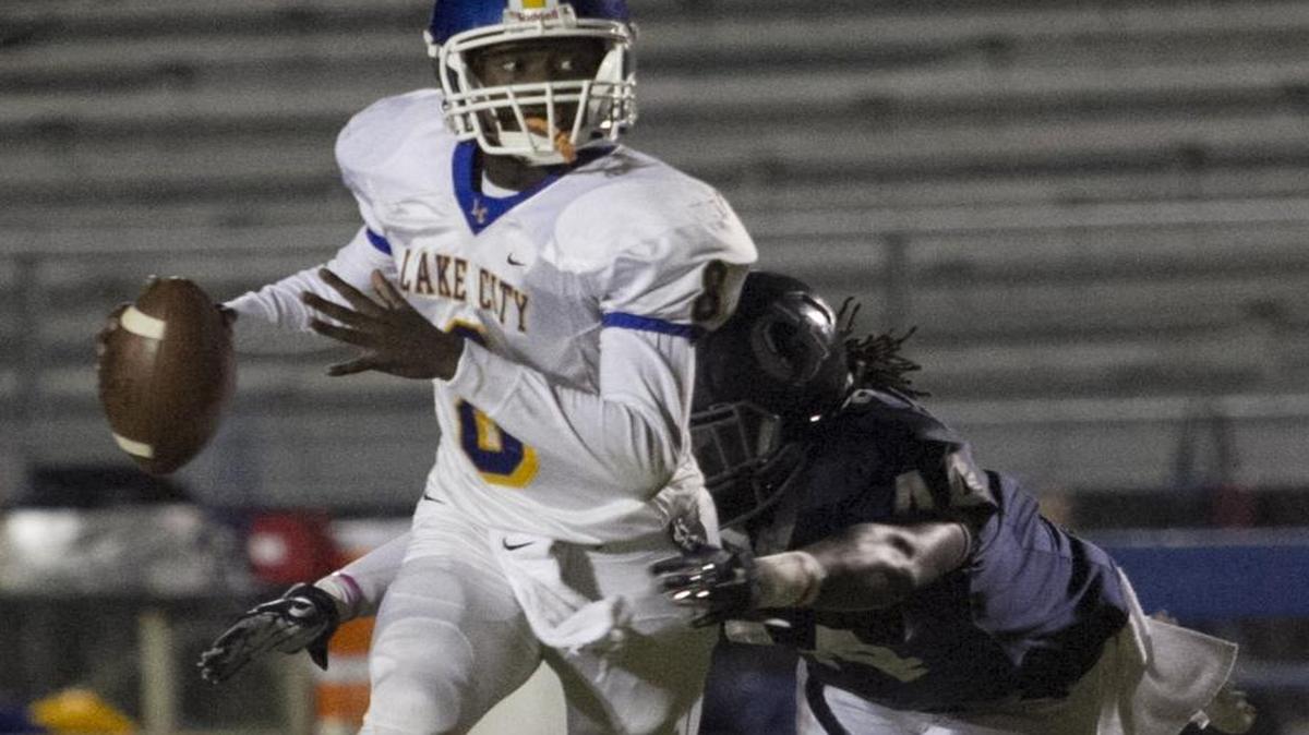 Georgetown linebacker Sheldon Billings brings down Lake City quarterback Chris Burnett during a game last season.