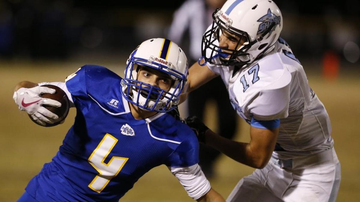 North Myrtle Beach running back Kered Class (4) runs by St. James defender Grant Duvall during the matchup between rivals last season.