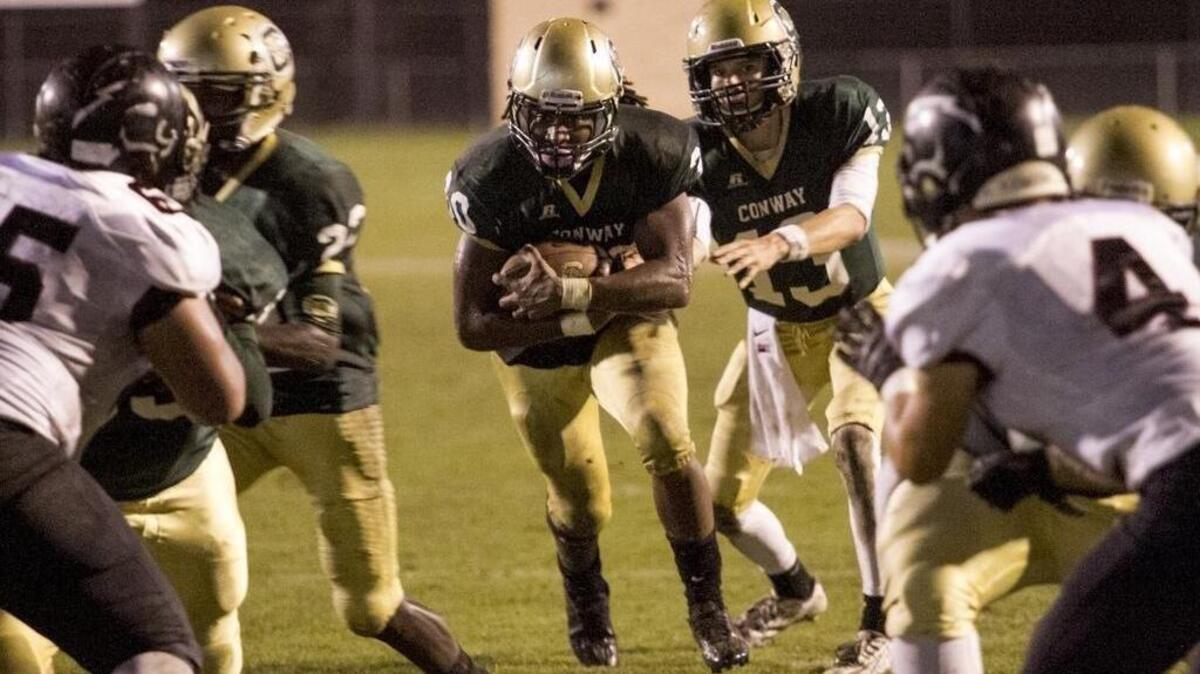 Conway's Jah'Maine Martin finds running room against rival Carolina Forest two weeks ago. The Tigers host Westwood tonight (Friday) in the first round of the Class AAAA- Division II playoffs.