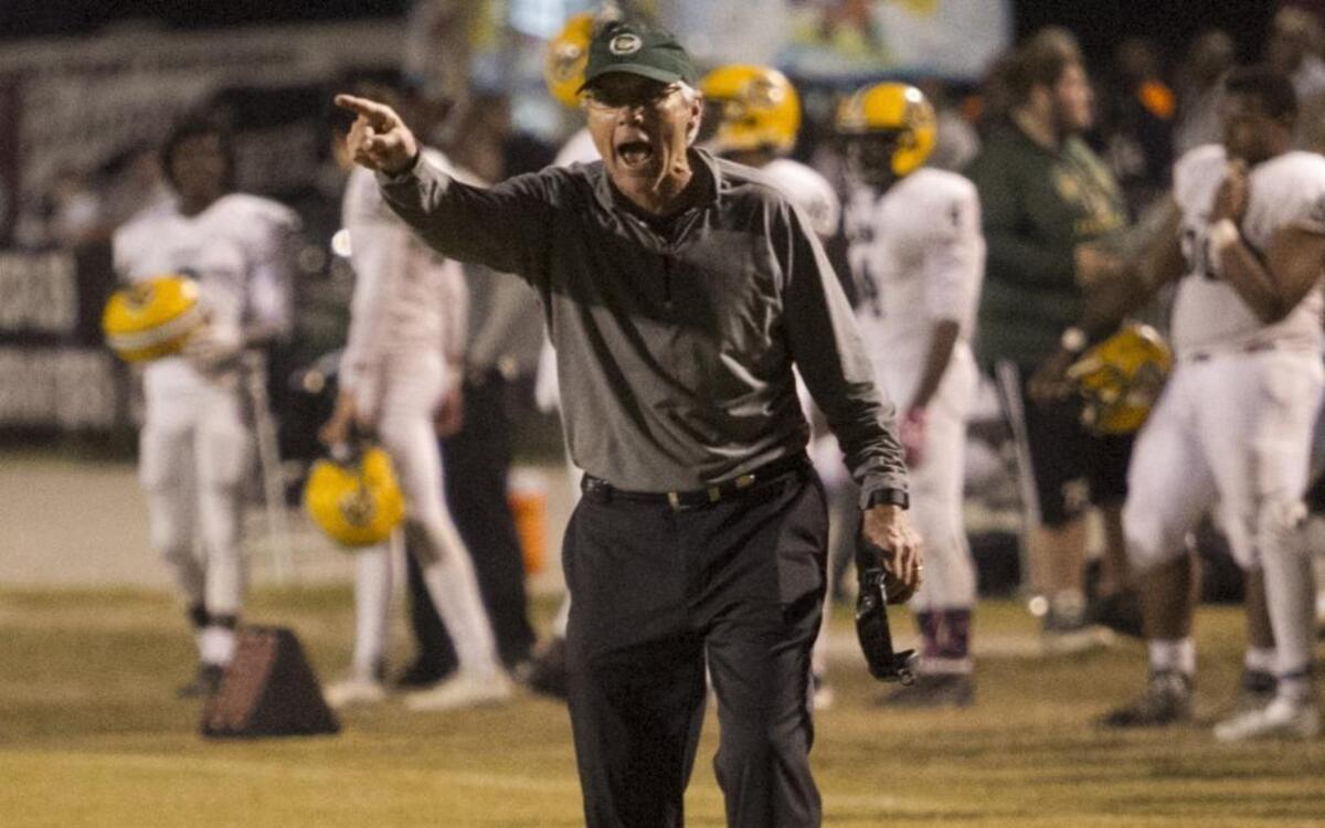 Conway Coach Chuck Jordan attempts to get a referee’s attention during a game last season. The longtime Tigers head man was arrested on Thursday, according to J. Reuben Long Detention Center records.