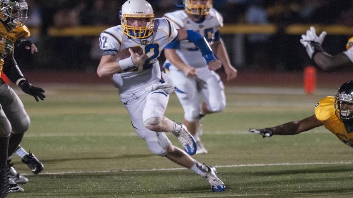 North Myrtle Beach quarterback Ronnie Bass scrambles for a big gain against Myrtle Beach. With Hurricane Matthew churning in the Atlantic, local teams will not take the gridiron. To help with the matter, the S.C. High School League has opted to add another week to the football calendar.
