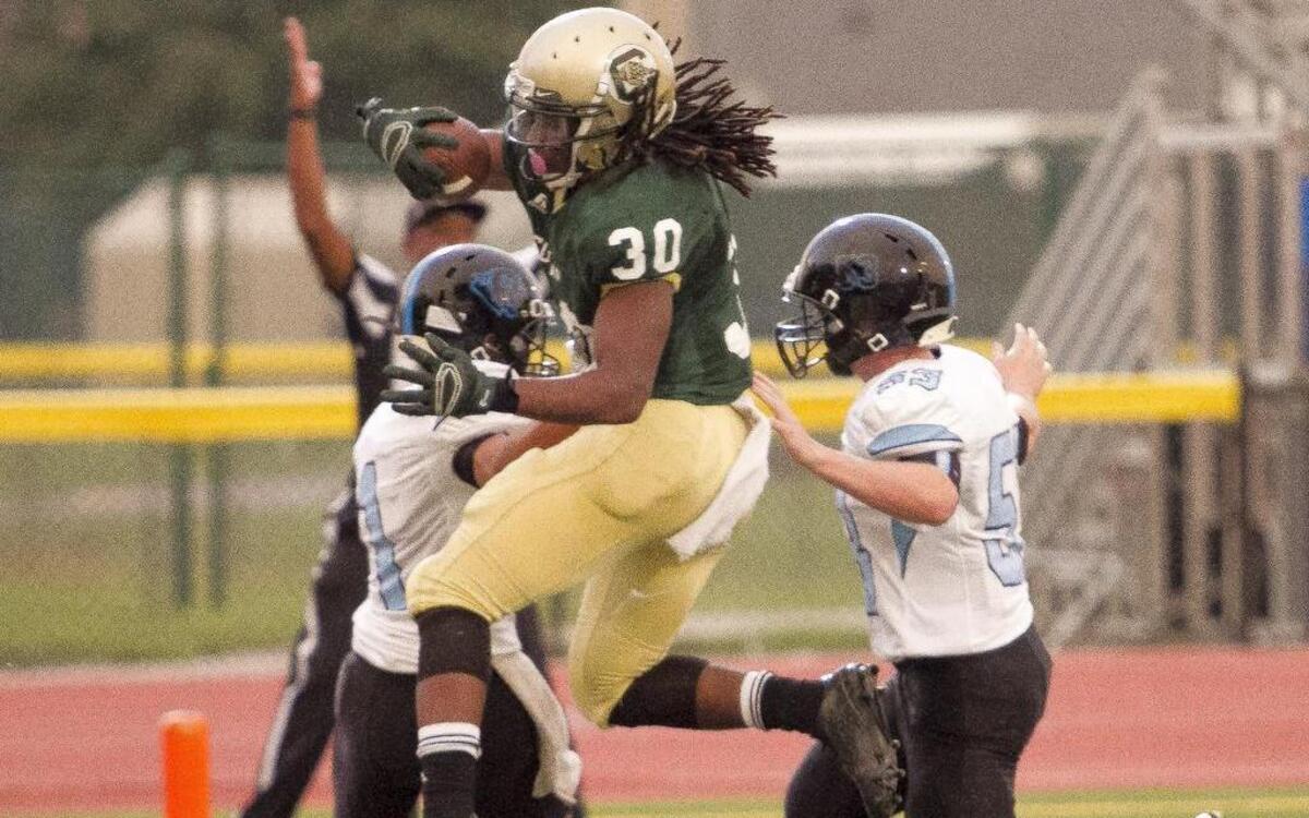 
Conway's Jah-Maine Martin scores a touchdown against South Brunswick in the Derrick Law Firm Carolinas Kickoff Clash. Conway shut out South Brunswick 55-0
