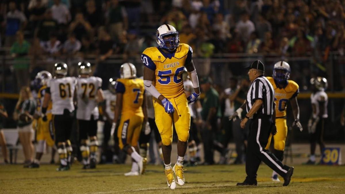 North Myrtle Beach defensive end Kwame Livingston (50) celebrates a sack against rival Myrtle Beach.