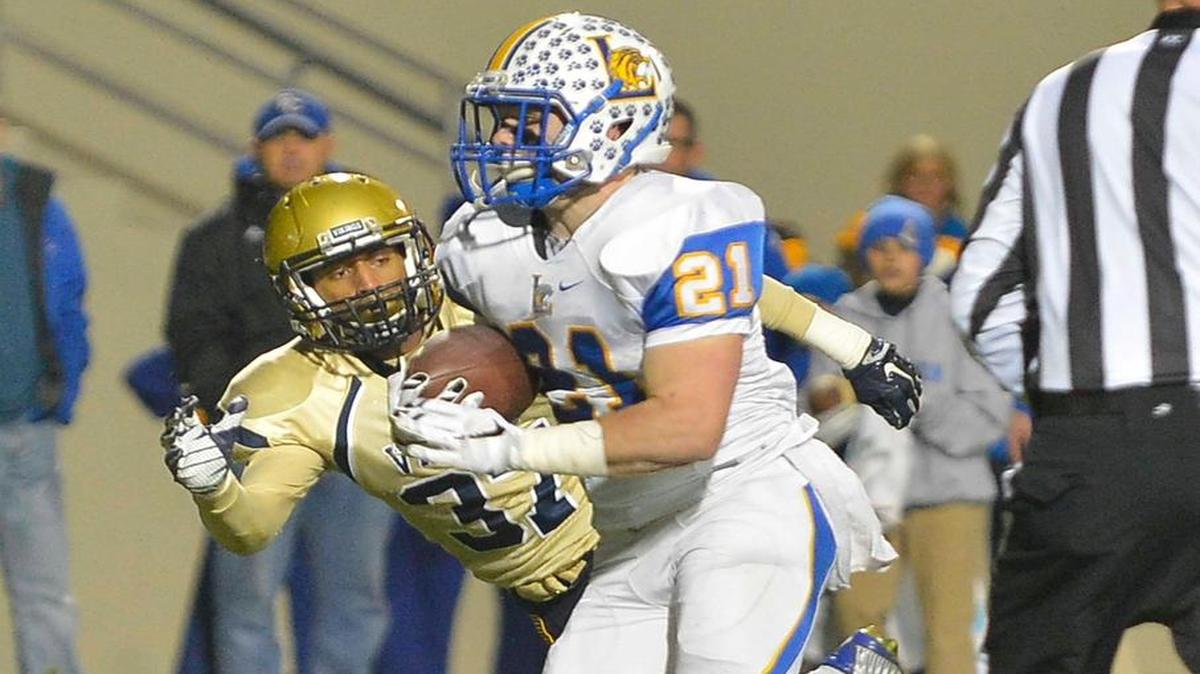 Lexington’s Slade Carroll (21) looks for room against Spartanburg on Friday.