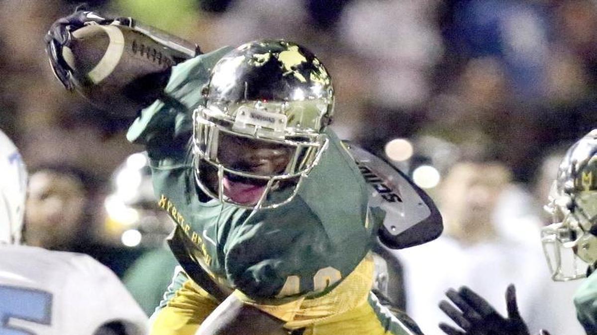 
Myrtle Beach’s Elijah Rice gains yardage through the air against St. James on Friday night.
