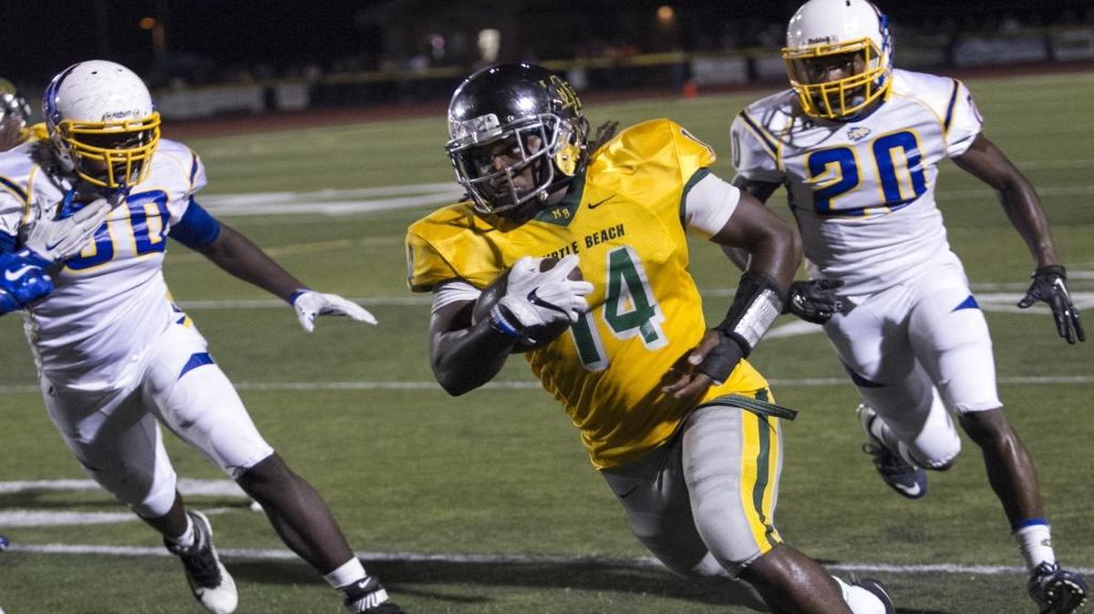 Myrtle Beach’s Keyonte Sessions runs for big yardage against Myrtle Beach.