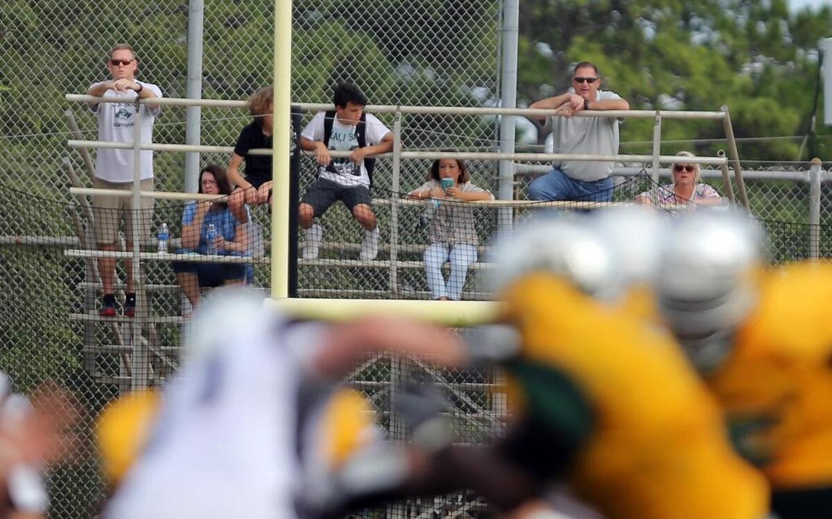 As workers scurried to complete renovations at Doug Shaw Memorial Stadium, fans filled much smaller Ashley Booth Field to watch Myrtle Beach take on Charlotte (N.C.). Due to limited seating, some watched the game from surrounding softball and baseball fields.