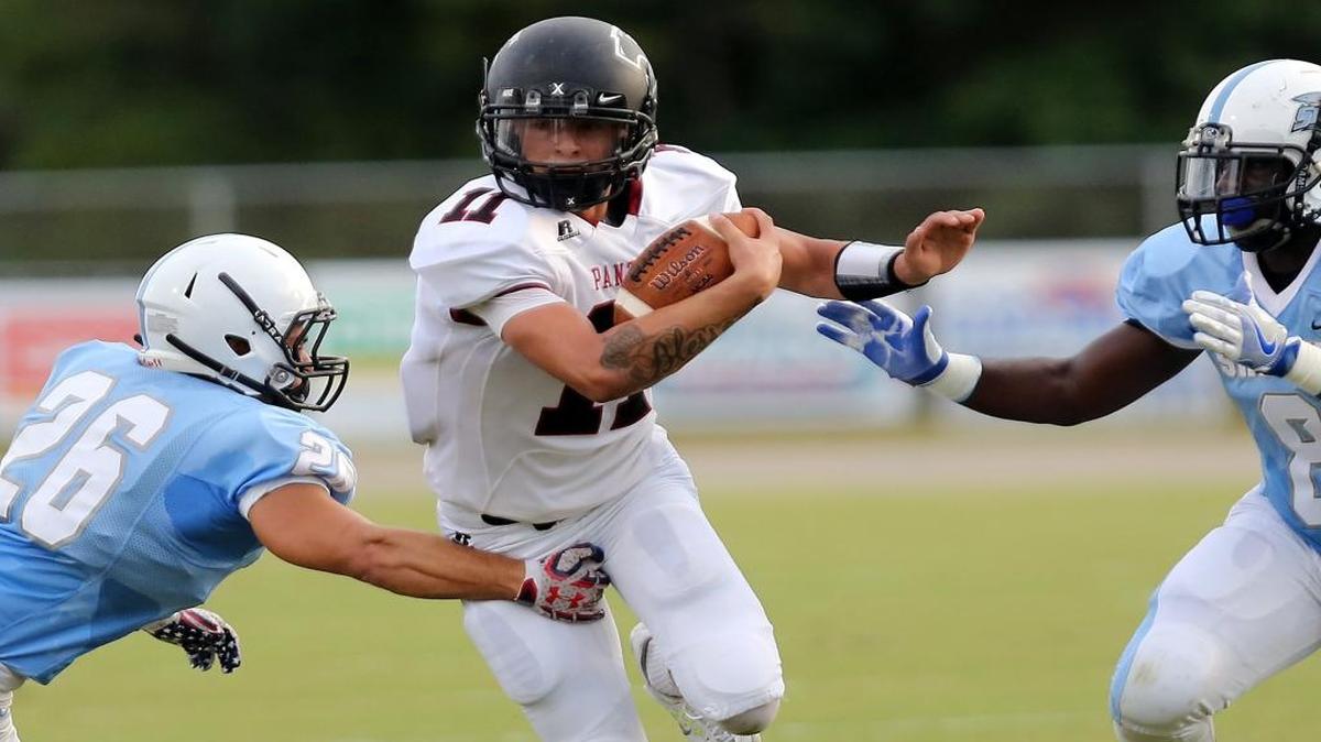 Carolina Forest all-purpose man Ishmael Garcia seeks to elude St. James tacklers during a recent game. The Panthers seek to pull an upset on Friday night, taking on Class 4A’s top-ranked team in Myrtle Beach.